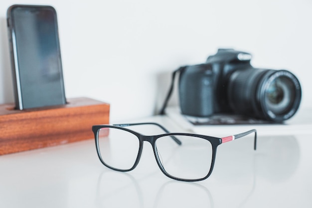 Photo close-up of eyeglasses on table