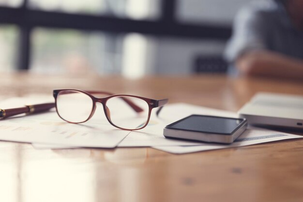 Photo close-up of eyeglasses on table