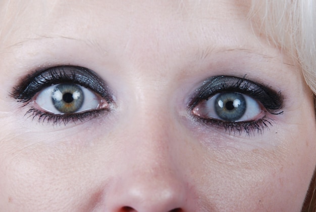 Close up the eyes of a young blond woman