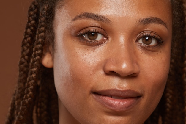 Close-up of face of African young woman with perfect skin 