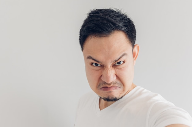 Close up face of angry man selfie himself.