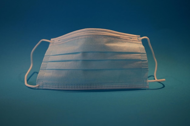 close-up of face mask against blue background
