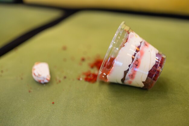 Close up of fallen chocolate cake on sofa at cafe