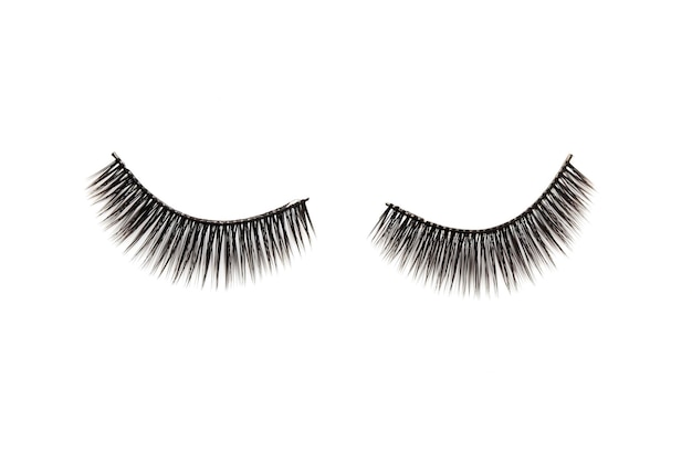 Photo close-up of false eyelashes against white background