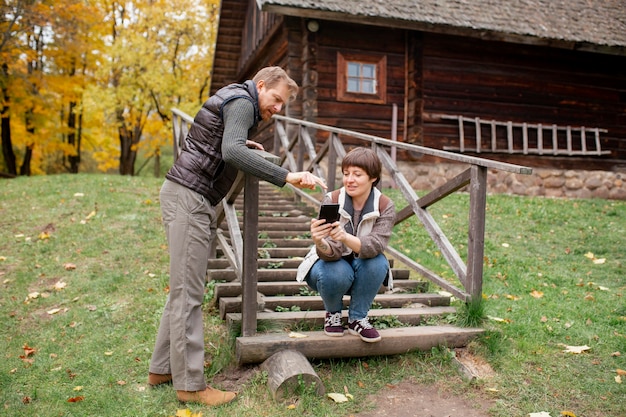 Photo close up on farmer using digital device