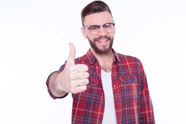 Close up fashion portrait of young bearded man Smiling hipster guy Handsome man in stylish hat Brutal bearded boy in trendy glasses