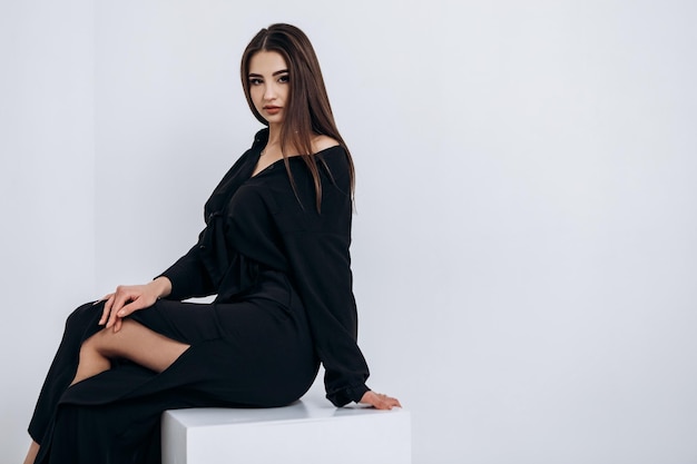 Close up fashion portrait of young pretty indian latin american woman posing in photo studio