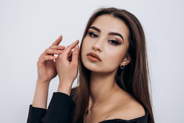 Close up fashion portrait of young pretty indian latin american woman posing in photo studio