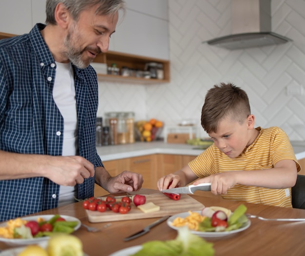 Photo close up  father and kid cooking