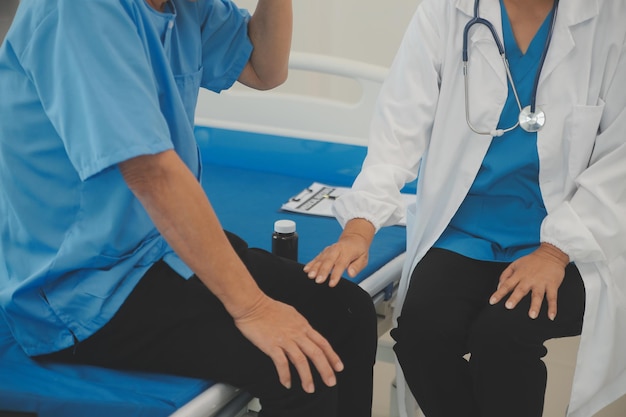 close up of female doctor using stethoscope putting beat heart diagnose with patient in examination room at a hospital checkup body medical and health care concept
