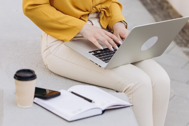 Close up of female hands of business woman professional user worker using typing on laptop notebook