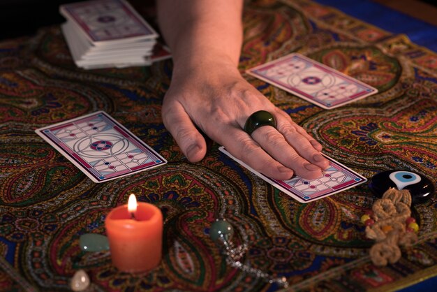 Close up female hands holding tarot cards. fortuneteller.\
witchcraft