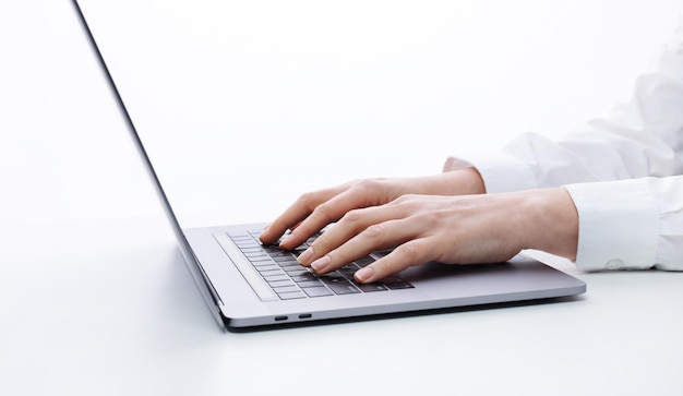 Close up of female hands typing