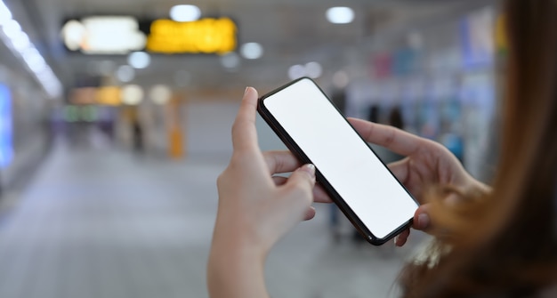 Close-up of female's hand and smartphone 