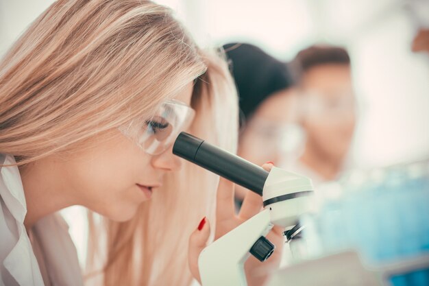 Close up. female scientist studying the features of the coronavirus. science and health