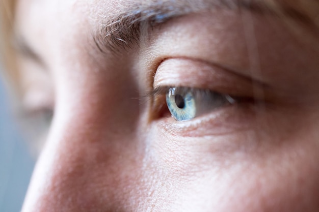 Close up of feminine natural blue eyes cut out of the face healthcare