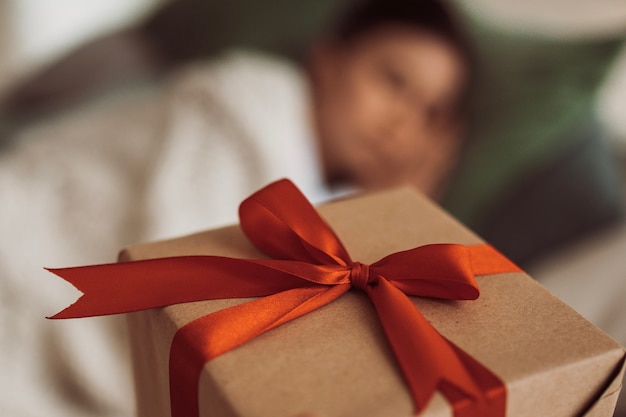 Photo close up on festively wrapped christmas gift box