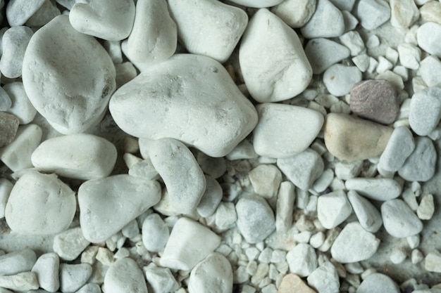 Close-up of few white stones, front view.