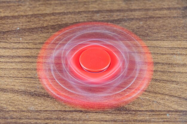 close-up of fidget spinner spinning on table