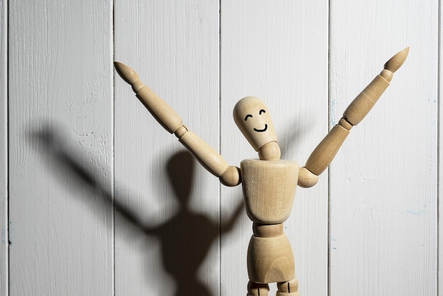 Close-up of figurine on table against wall