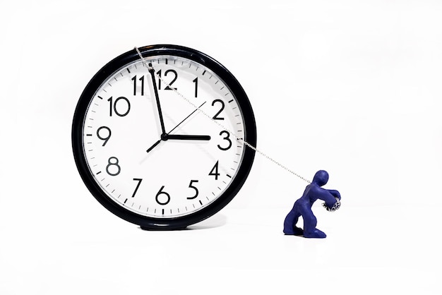 Close-up of figurine with clock