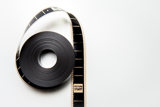 Photo close-up of film reel against white background