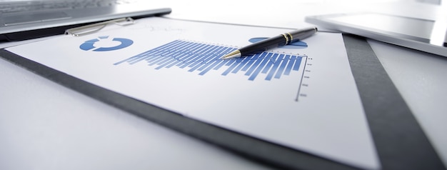 Photo close up financial chart on the table at the businessman