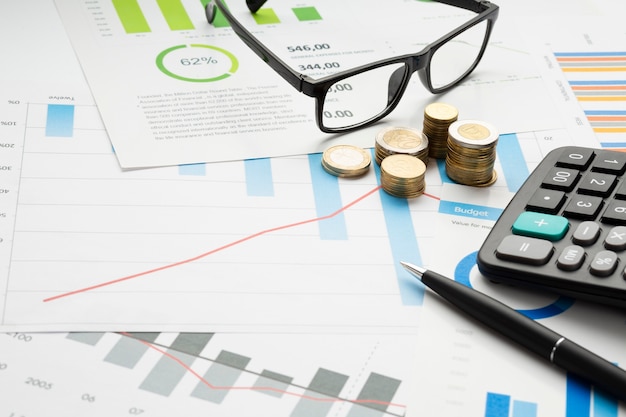 Photo close-up financial instruments with glasses