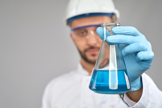 Close up of flask with blue liquid