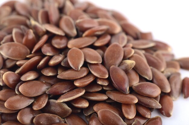 Photo close up of flax seeds isolated on white background