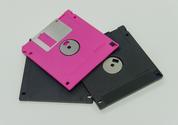 Close-up of floppy disks over white background