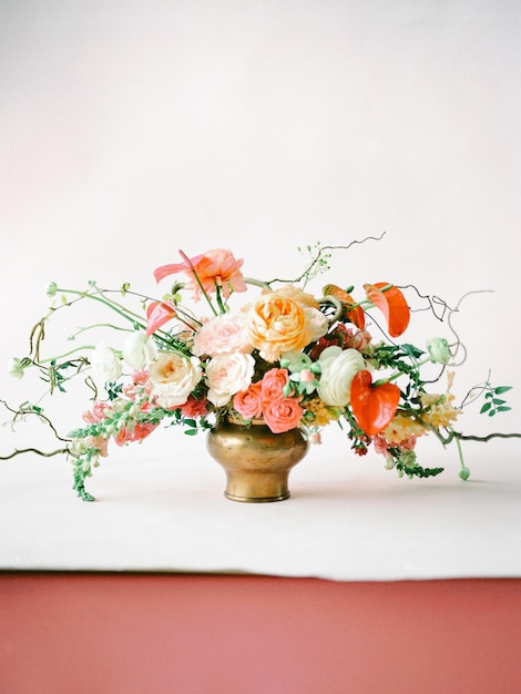 close-up of flower vase on table against white wall