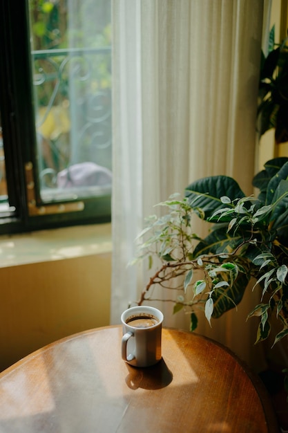 Photo close-up of flower vase on table at home