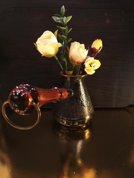 Close-up of flower vase on table