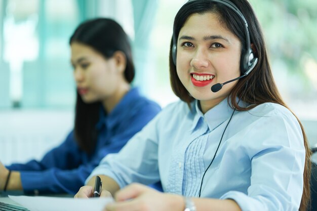 close up focus on asian call center woman