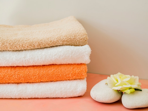 Close-up folded clean towels with flower