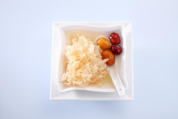 Photo close-up of food in bowl over white background