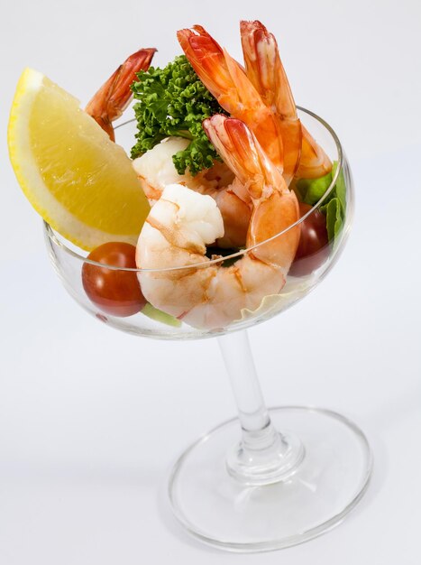 Close-up of food in glass container against white background