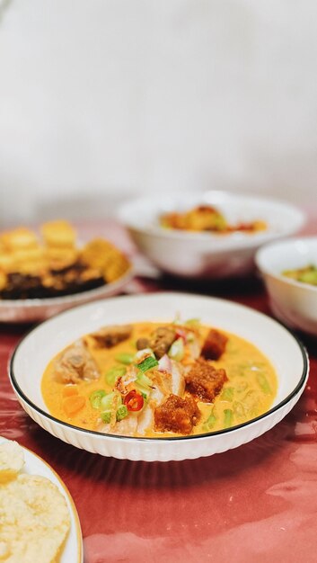 Close-up of food in plate on table lontong sayur