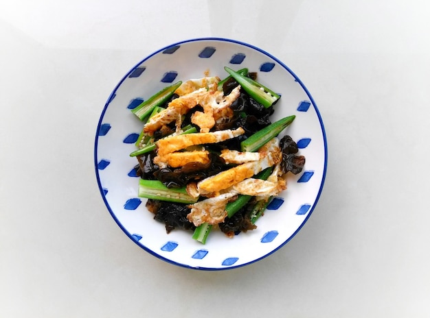 Photo close-up of food in plate on white background