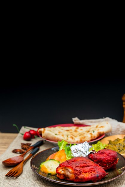 Photo close-up of food served on table against black background