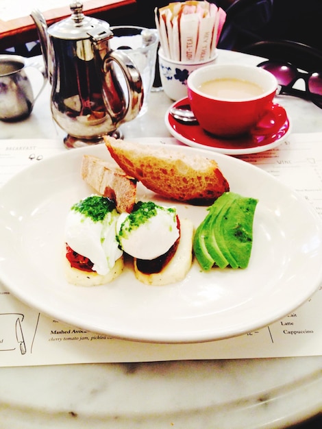 Photo close-up of food served on table