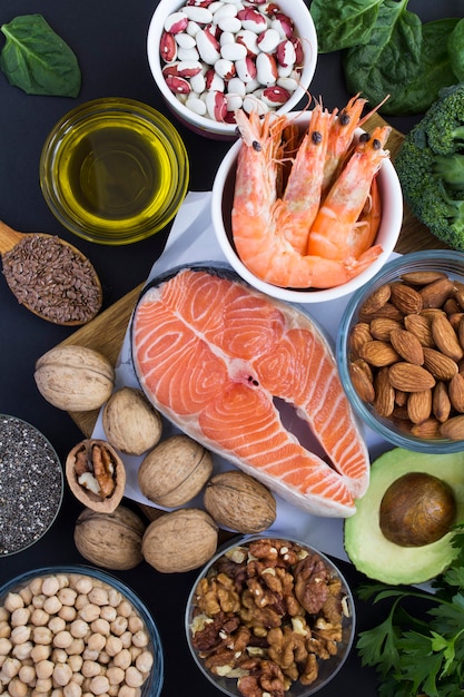 Close-up on food sources of omega-3 on the black  background. Food hight in fatty acids.