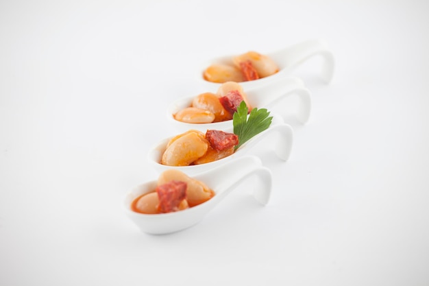 Photo close-up of food in spoon against white background