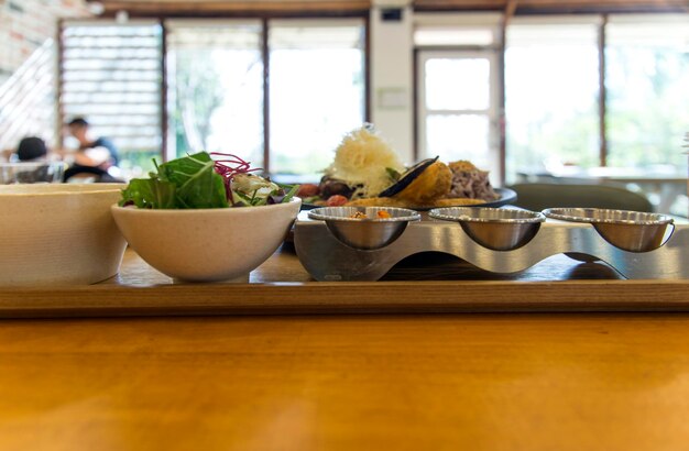 close-up of food on stand against window