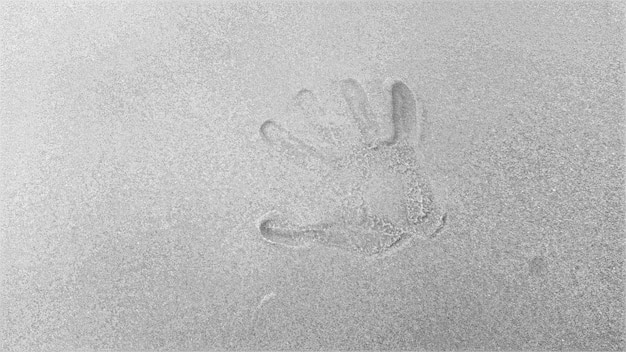 Photo close-up of footprints on sand at beach