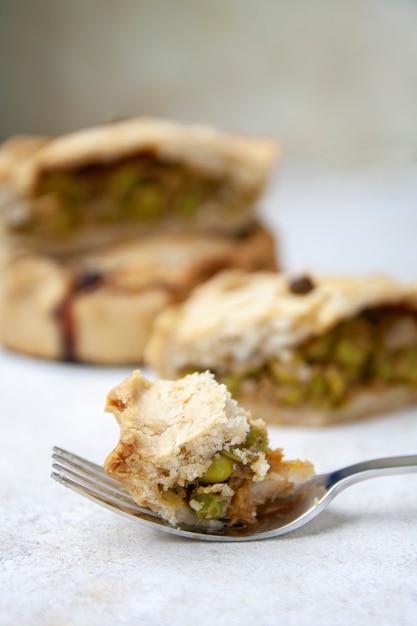 Close-up of fork with piece of mallorcan pea pie