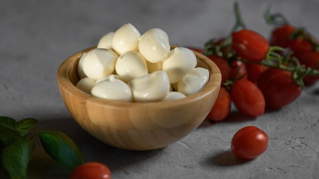 Close up of fresh apulian mozzarella cheese in a wooden bowl food made in puglia italy