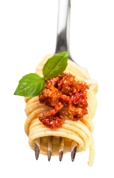 Close-up of fresh delicious pasta on fork isolated on white background