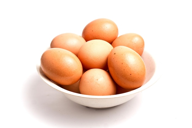 Close-up of fresh eggs in a white bowl